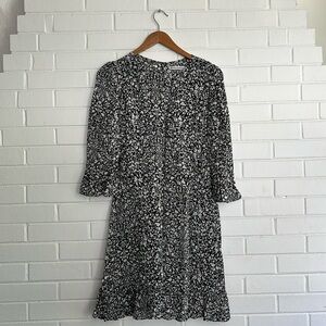 Reformation long sleeve dark blue patterned dress.